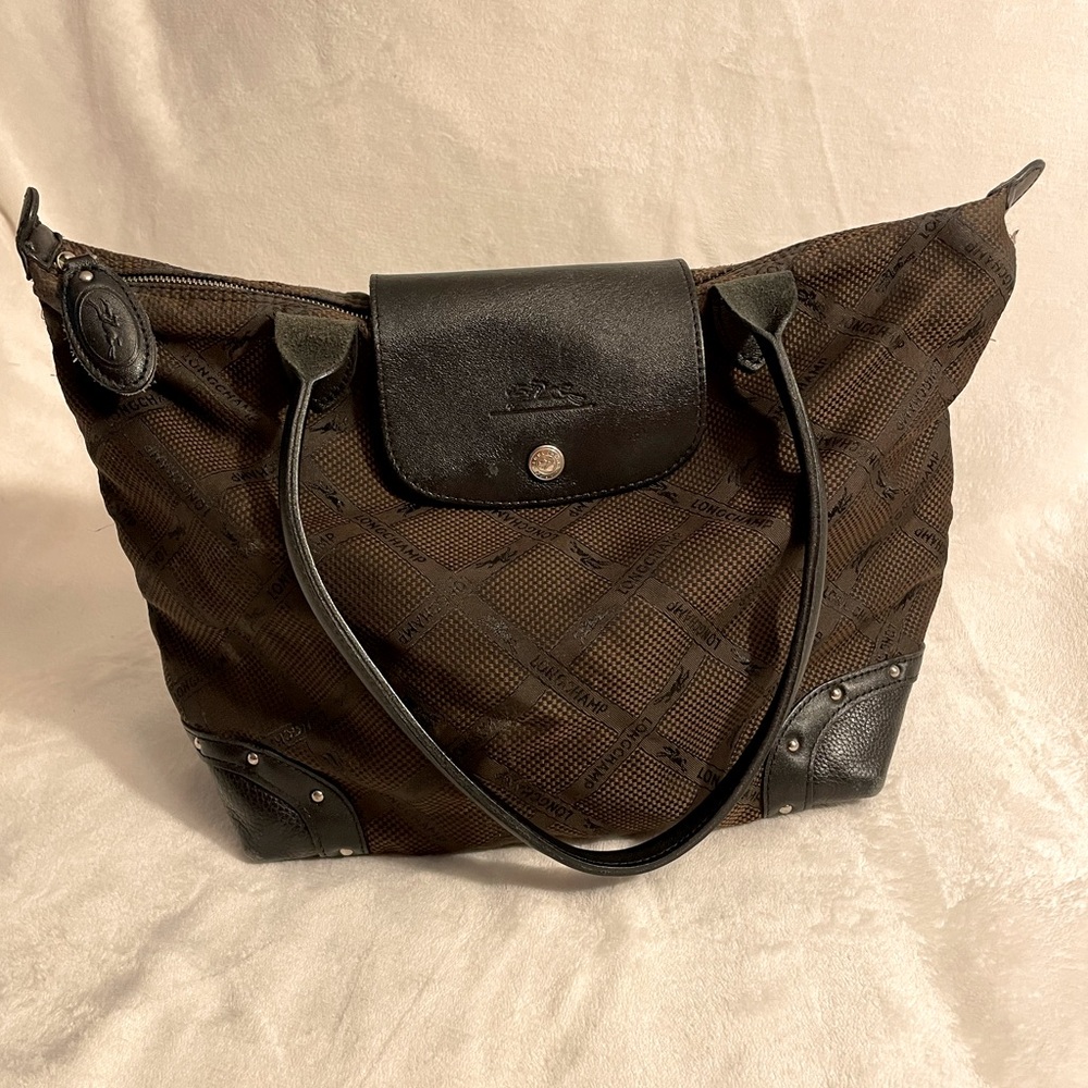 Longchamp Women’s black & dark brown leather/ nylon canvas tote.